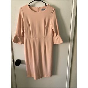 Peach dress with peplum flare mid arm sleeves, size 6.